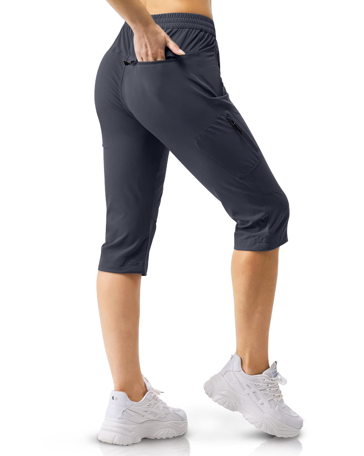 33000ft women's golf capri pants model wearing, showing comfortable fit outdoors