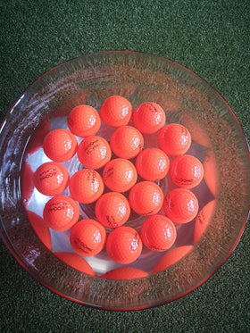 A99 Golf Floater ball in orange color for high visibility during water practice.