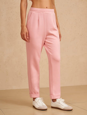 ACEGOLFS women's golf pants side view pink, sleek tapered fit for flattering silhouette.