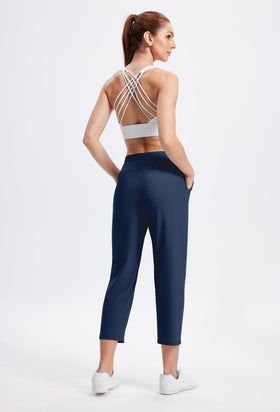Alaroo Rexley pants navy 7/8 length on model elongates silhouette.