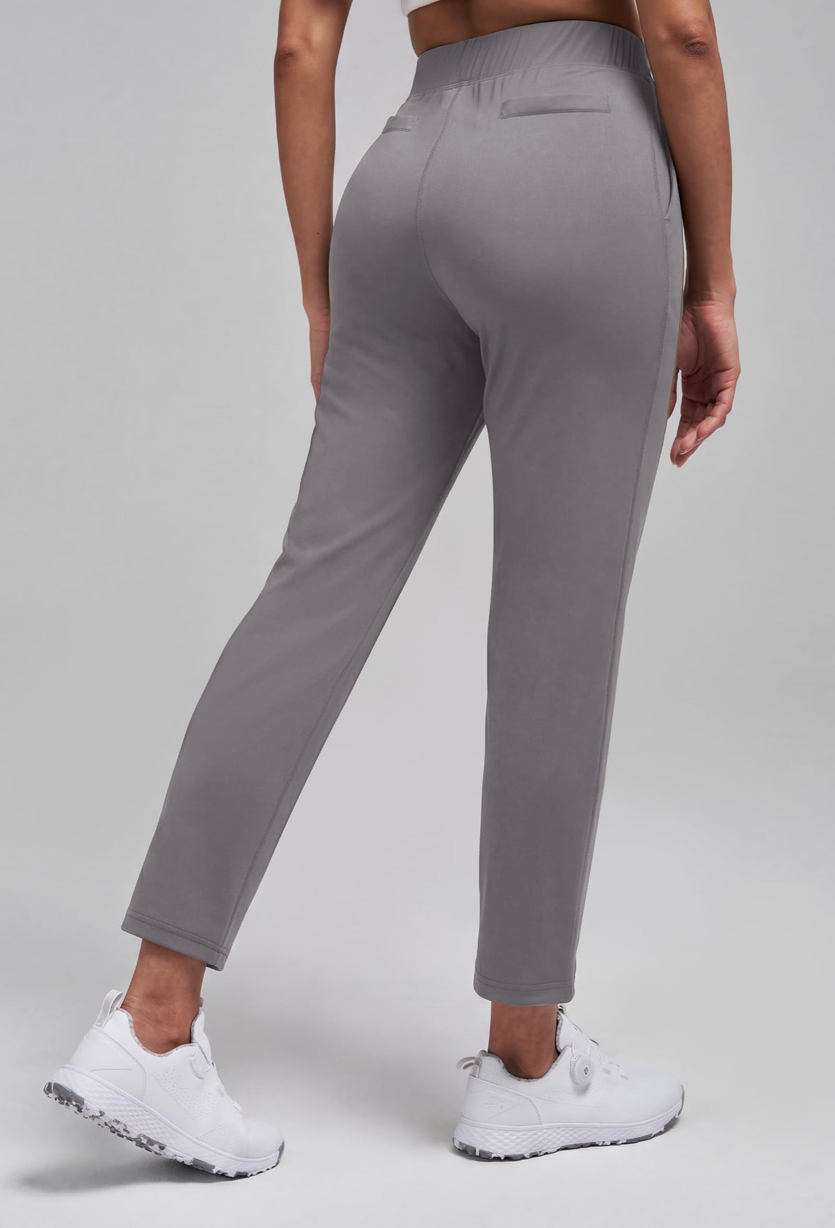 Alaroo women's golf pants on model 7/8 ankle demonstrates flattering cropped silhouette.