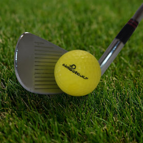 AlmostGolf ball on green illustrates authentic trajectory and control