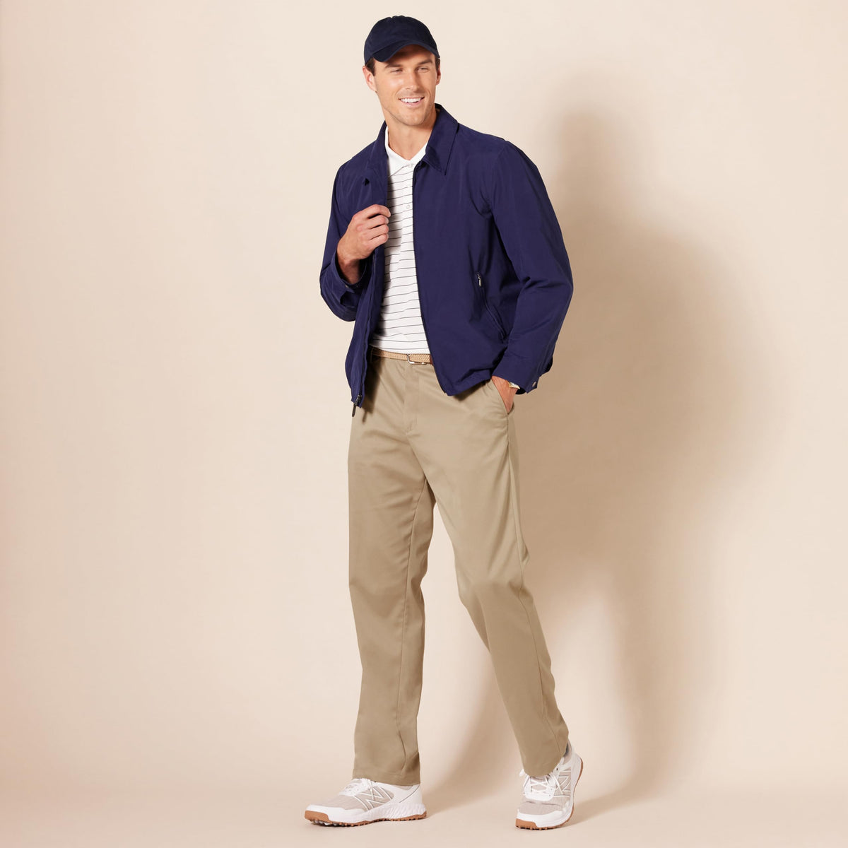 Amazon Essentials model wearing khaki golf pant for everyday versatility.