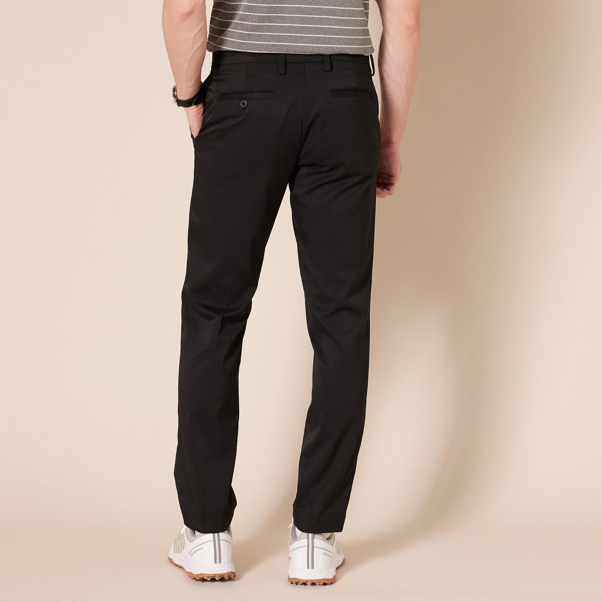 Amazon Essentials men's Slim-Fit stretch golf pant, back pocket detail ideal for small items.