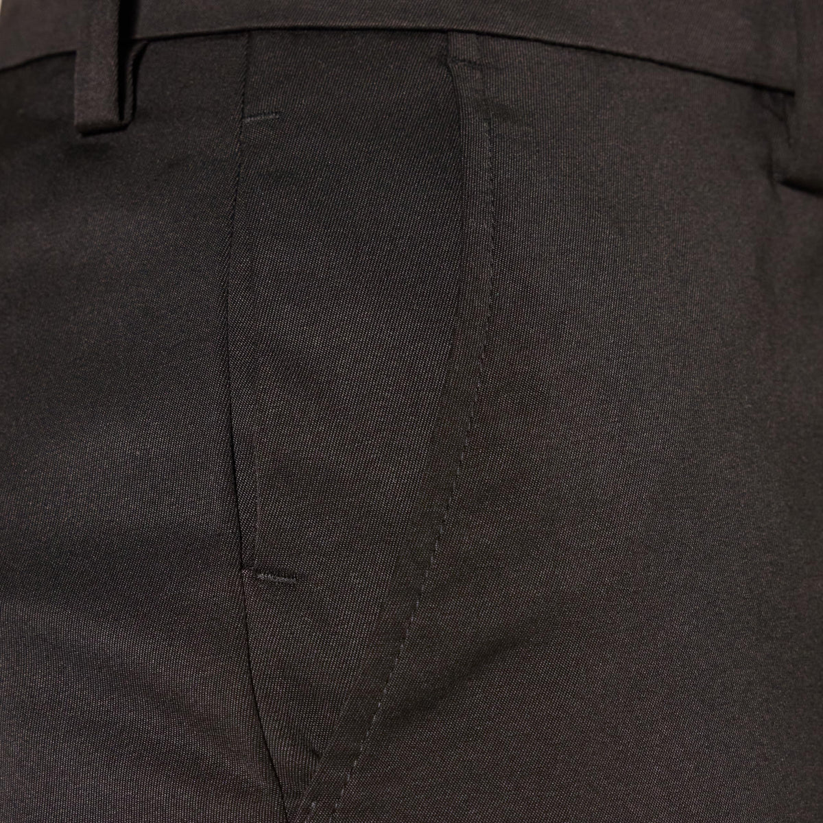 Amazon Essentials golf pant shown on green demonstrates all-day comfort