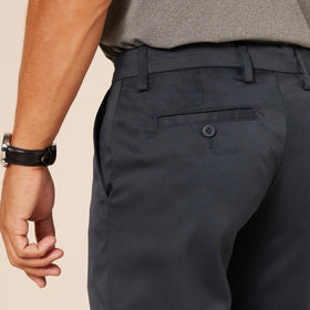 Amazon Essentials men's slim-fit stretch golf pants navy pocket detail highlighting practical storage.