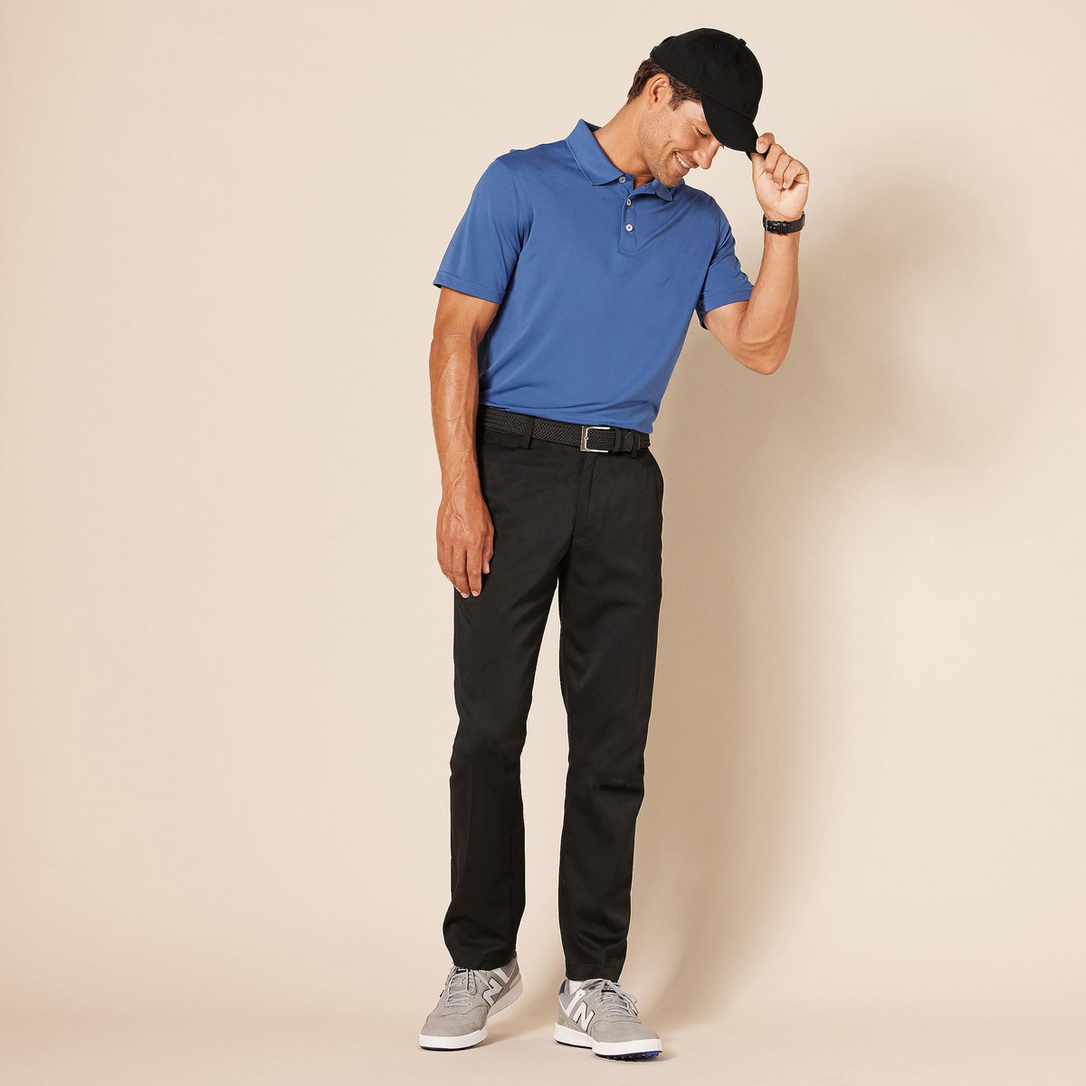 Amazon Essentials pocket detail on black golf pant for tees and small items