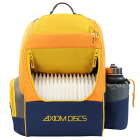 Axiom Discs Shuttle backpack in yellow ochre ready for a round of disc golf