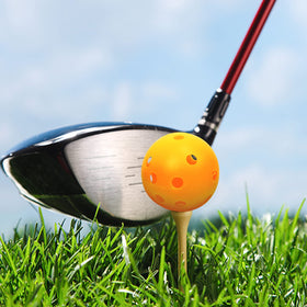 Backyard driving range setup with Bac-kitchen yellow golf balls for casual drills.