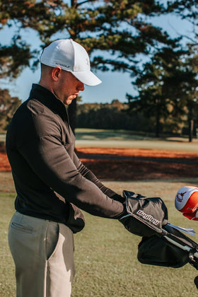 Bag Boy Hand Warmer Black in use extends comfort during windy rounds