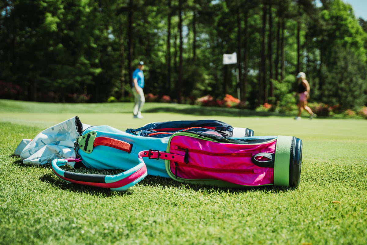 Bag Boy Loop Lite carries 3 zip pockets plus a mesh pocket for water bottle or speaker