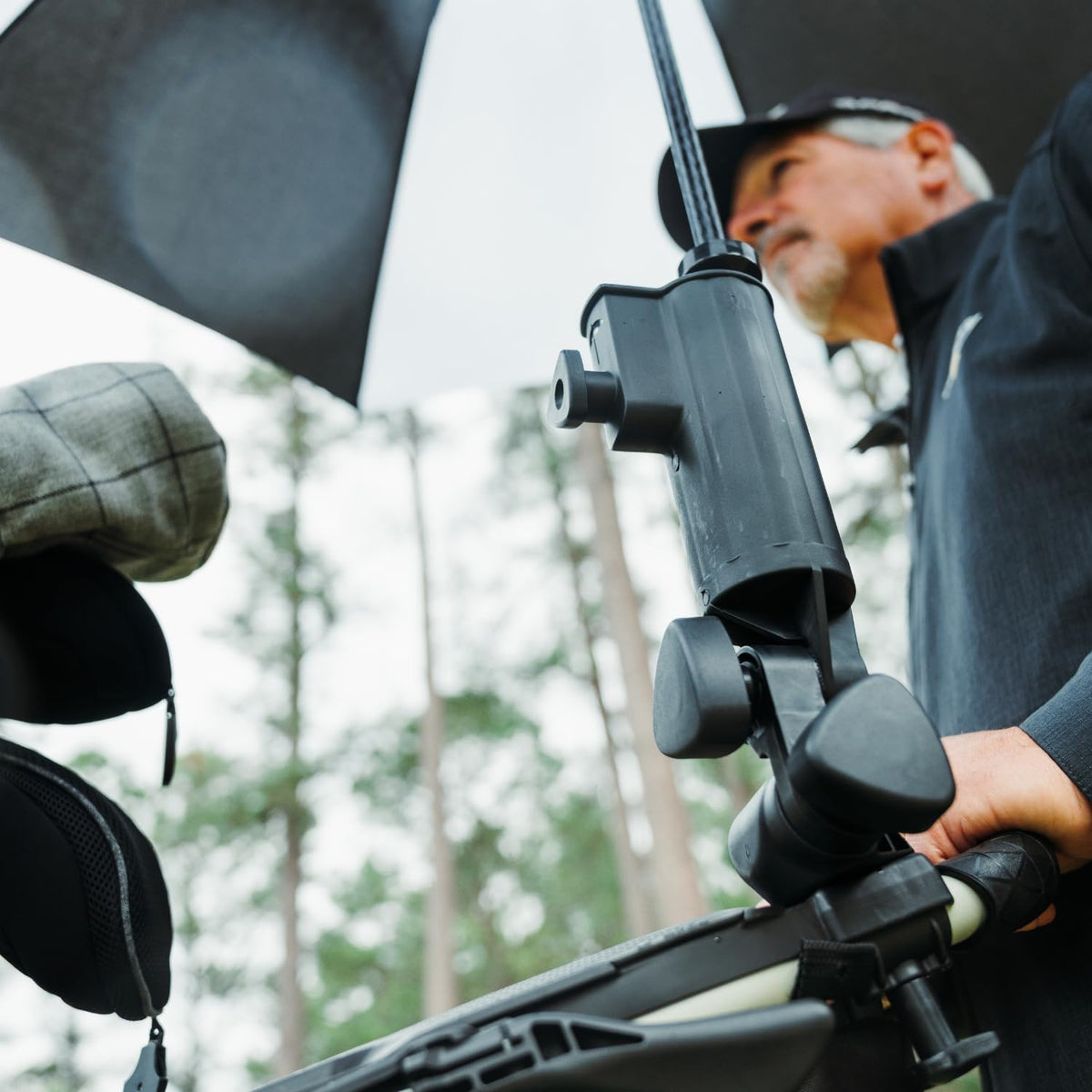 Bag Boy umbrella holder demonstrating adjustable internal width for different handle sizes