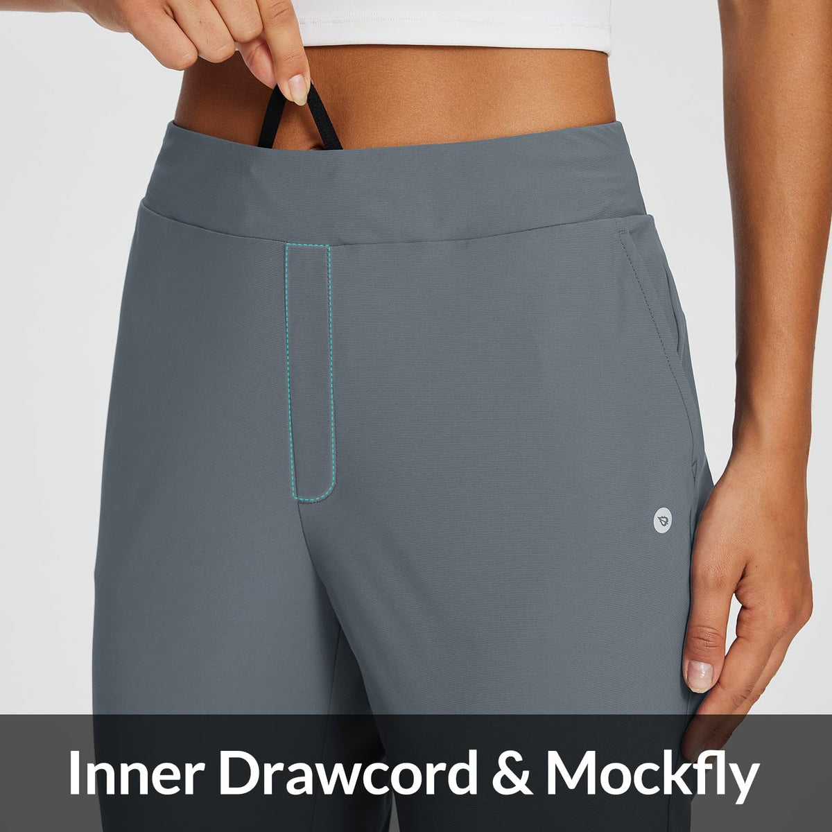 Baleaf pants with four pockets and back zipper for secure storage on the go.