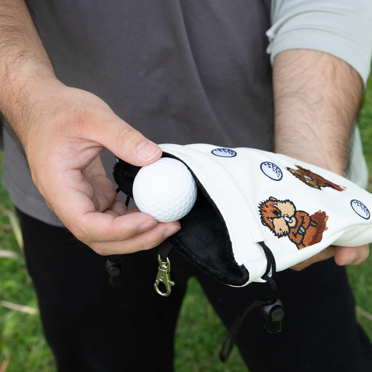 Barudan Golf valuables pouch stores tees, markers, and tools along with valuables on the course.