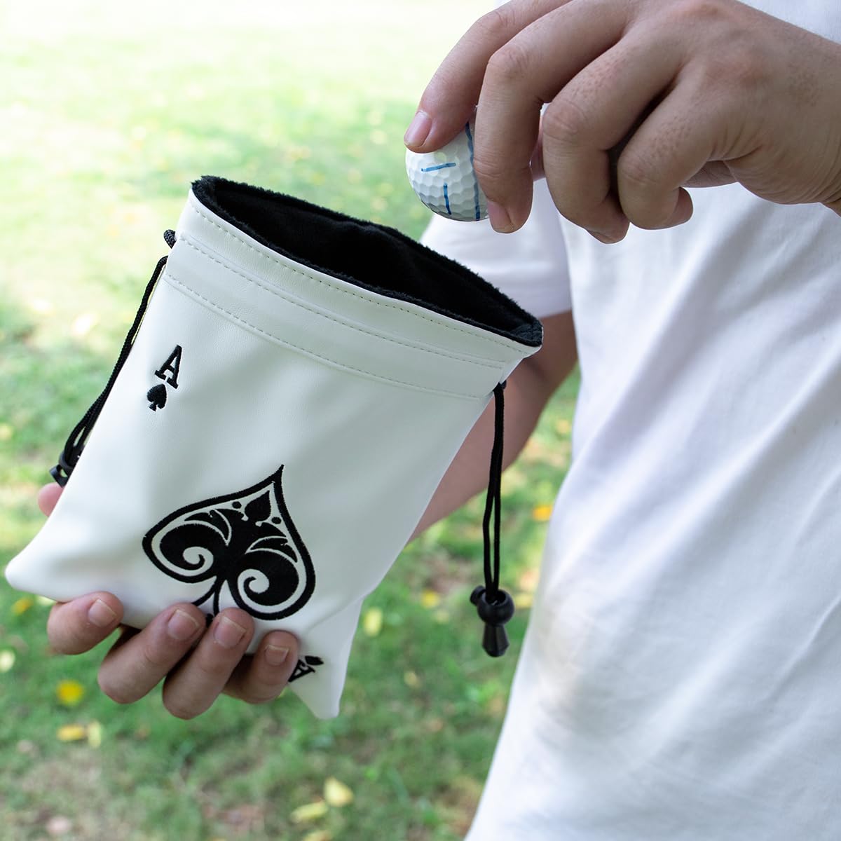 Drawstring closure with clip enables secure attachment to your golf bag