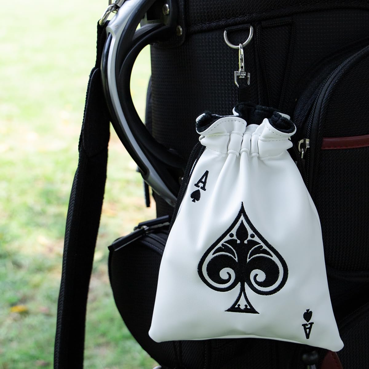 White synthetic leather pouch by Barudan Golf keeps essentials neatly organized