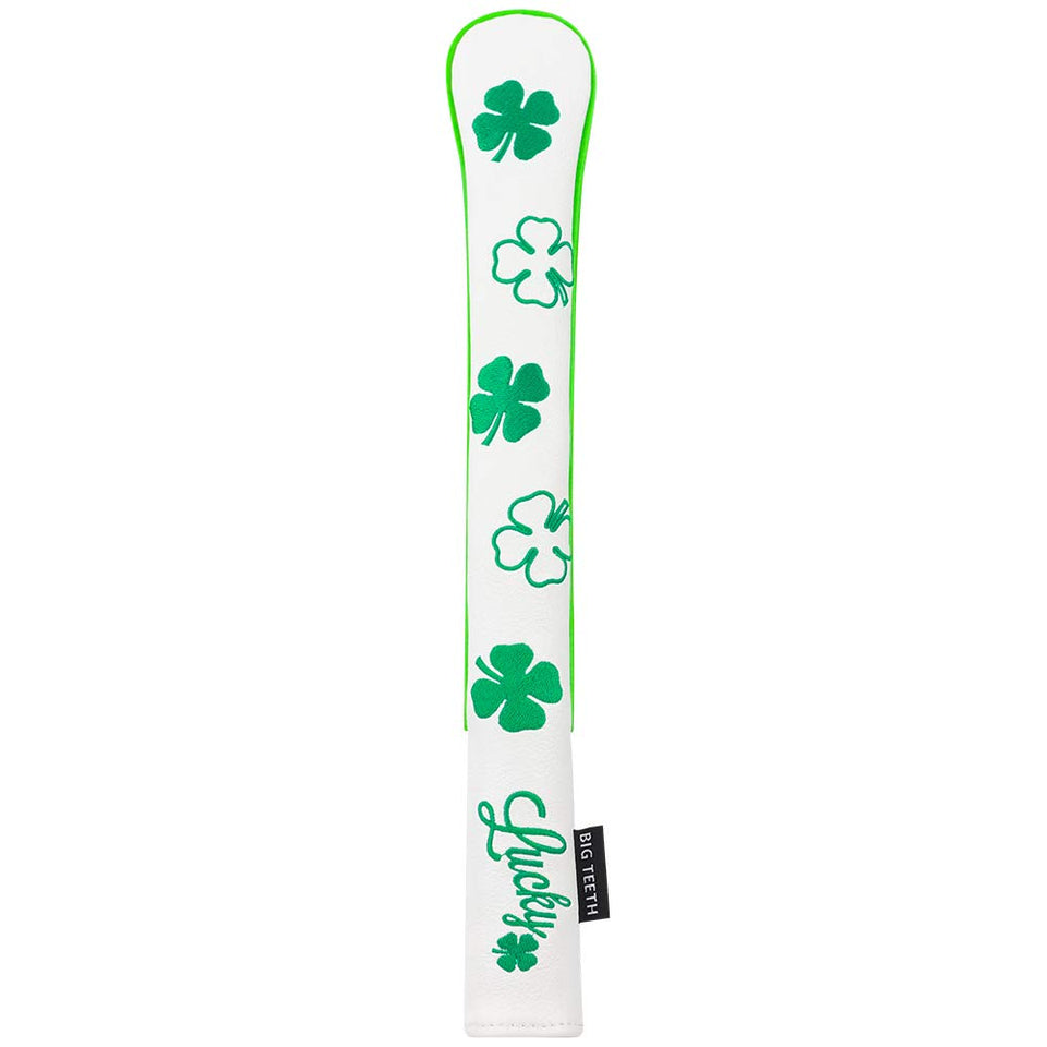 BIG TEETH golf alignment stick covers in white with lucky clover pattern, protecting sticks