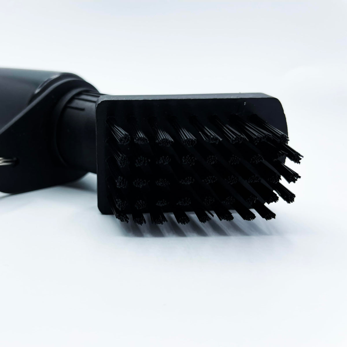 Birdskie retractable chain keeps the brush within reach on your bag