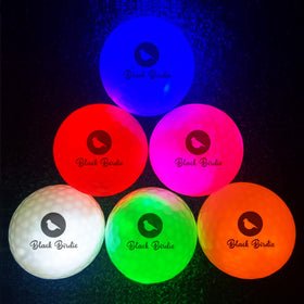 Close-up of LED glow on golf ball's dimples for durable design.