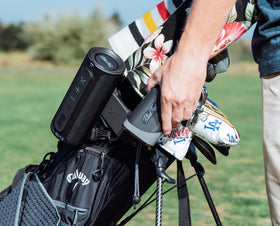 Blue Tees Golf Magnetic Hub attaches to golf bag for clutter-free carry