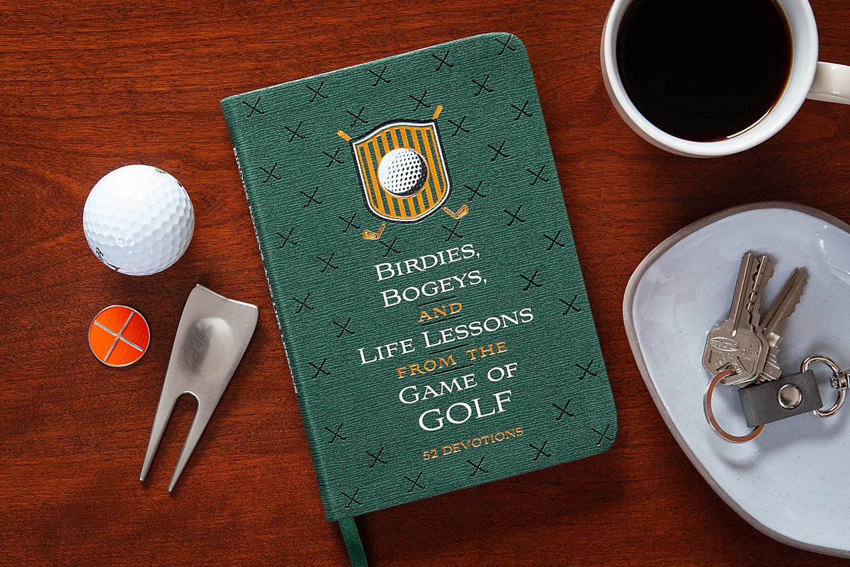Broadstreet Birdies Bogeys devotions in hand image highlights practical spiritual reflections.