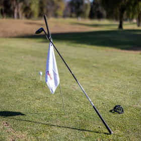 Caddy Jack ball pickup cap fits most putters for easy retrieval.