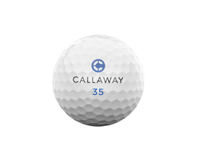Callaway Chrome Tour 2026 ball closeup shows chrome sheen and speed-enhancing mantle design.