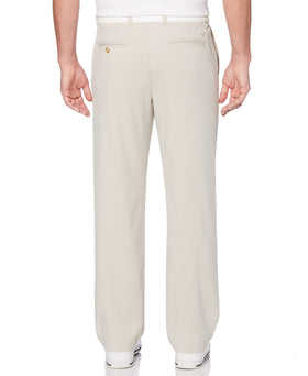 Callaway men's tech golf pants worn on course demonstrate lightweight comfort and pocket accessibility.