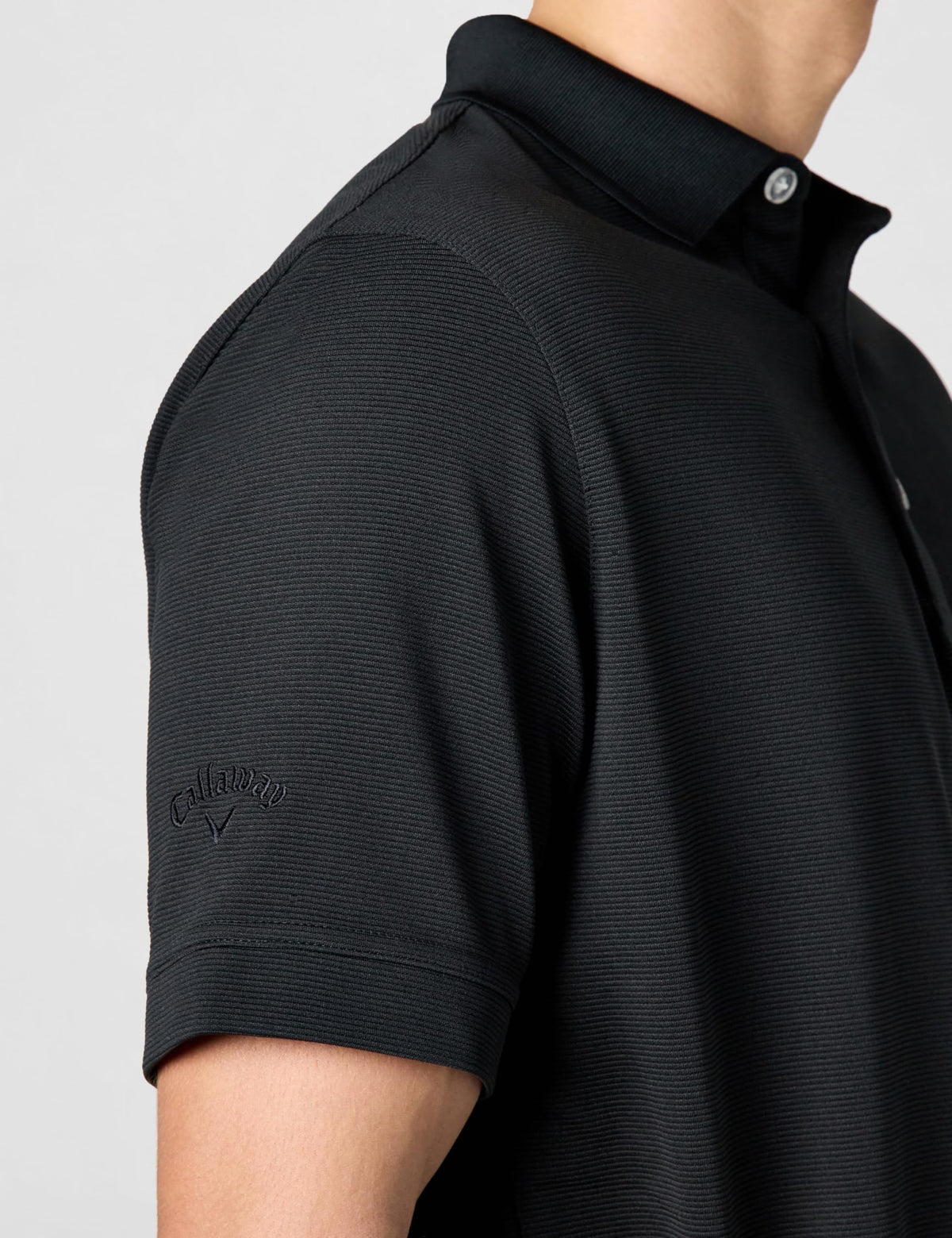 Callaway Opti-Dri polo shown on green, versatile for a focused round