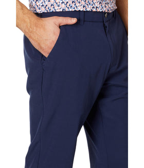 Callaway Swing Tech Pants peacoat on course, moisture-wicking and sun-protective