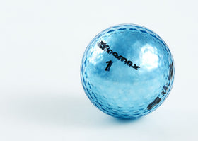 Chromax Metallic M5 green neon golf ball stands out in rough.