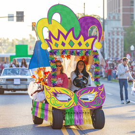 Cinrobiye outdoor Mardi Gras display enhances curb appeal