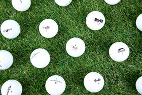 Clean Green Golf Balls ready to hit from tee to fairway.