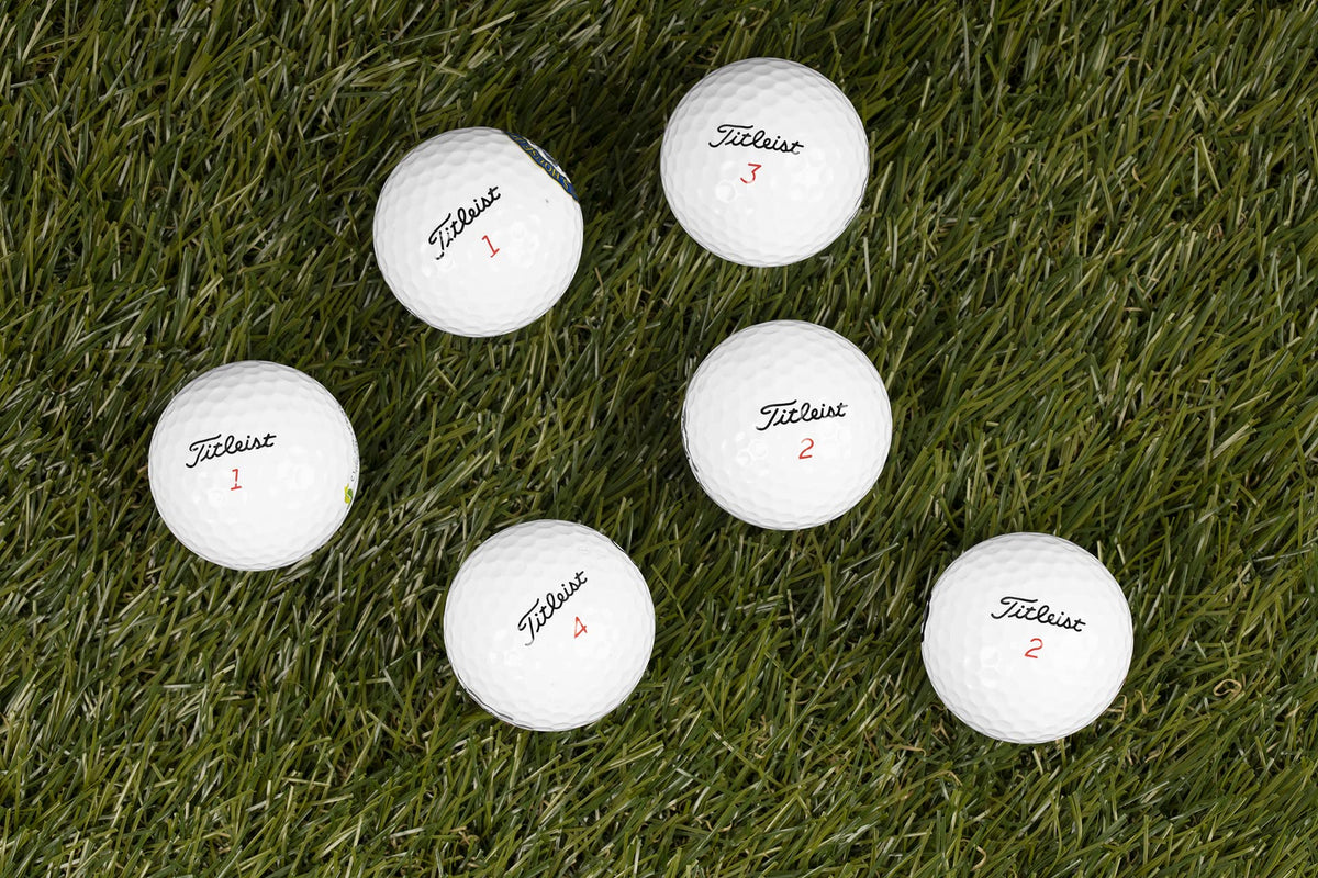 Clean Green Golf Balls show discoloration and logos, offering budget-friendly recycled options.