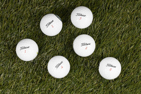 Clean Green Golf Balls show discoloration and logos, offering budget-friendly recycled options.