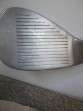 Cleveland Golf 588 Chrome Wedge finish on soft carbon steel provides durable greenside feel.