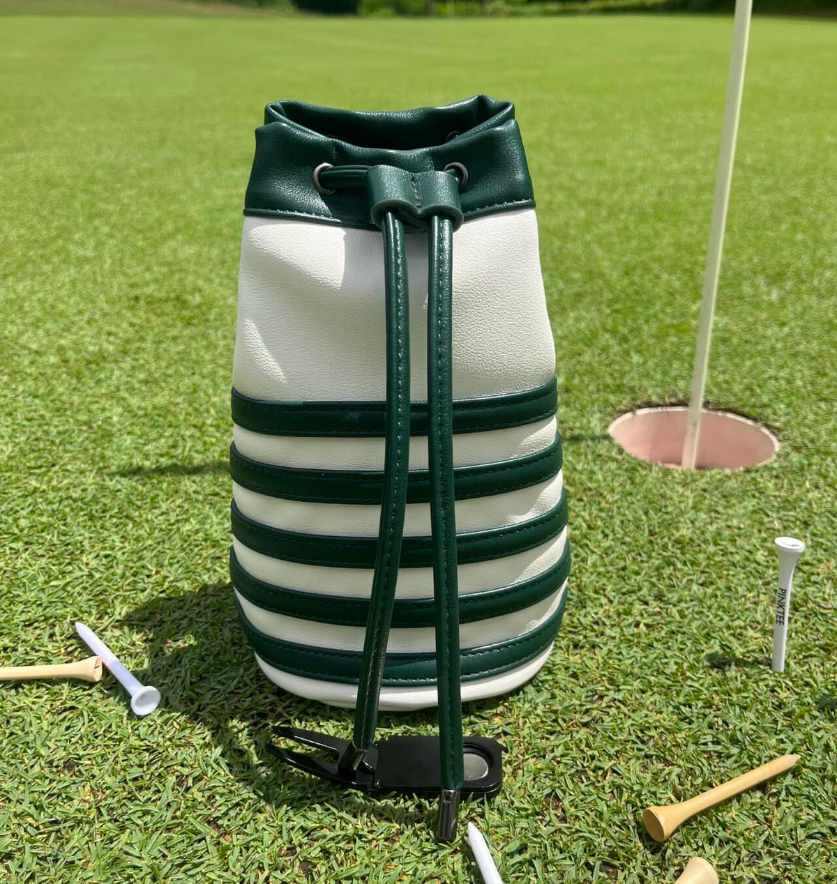 CROWNBLANKS PINKTEE pouch on golf bag provides organized accessory storage.