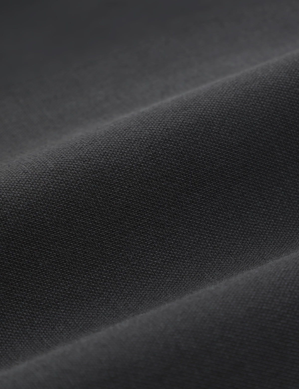 CRZ YOGA twill fabric in ink gray laid flat for everyday versatility.