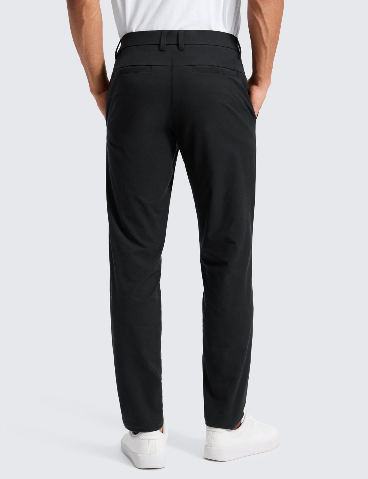 CRZ YOGA chino pants back view highlighting classic welt pockets for smart storage.