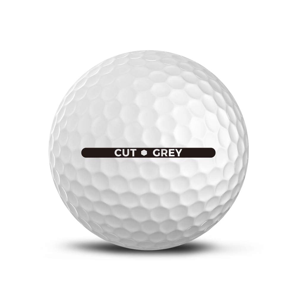 Cut Golf Cut Grey golf balls dimple close-up shows softer compression for control.