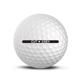 Cut Golf Cut Grey golf balls dimple close-up shows softer compression for control.
