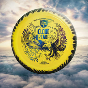 Discmania Eagle McMahon Cloud Breaker in-hand on a fairway demonstrates control-ready design