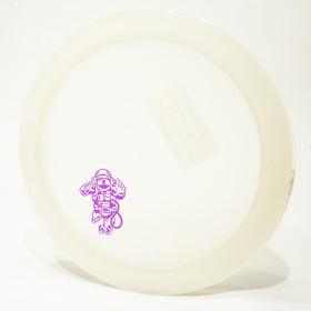 Discmania Glow Active Astronaut disc in flight with bright glow for low-light throws.