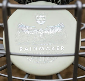 Discmania Rainmaker Glow over the basket highlights glow-in-the-dark visibility.