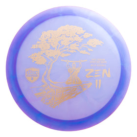 Discmania Zen 2 signature disc resting after a smooth release on grass.