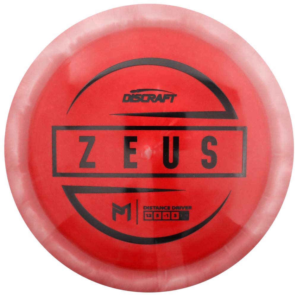 Discraft Paul McBeth Zeus ESP distance driver shown in flight, ideal for max distance and consistency.