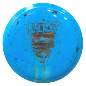Blackout disc on green teepad illustrating compact form and usability.