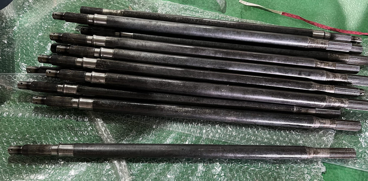 Dr.Acces rear axle shaft on workbench, ready for install