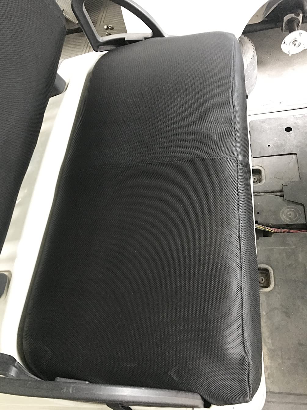 Dr.Acces golf cart seat cover being easily installed on an EZGO TXT bench seat.