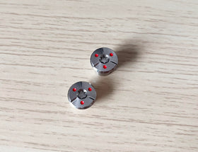 Dree weight screws shown on a golf club for precise adjustments.